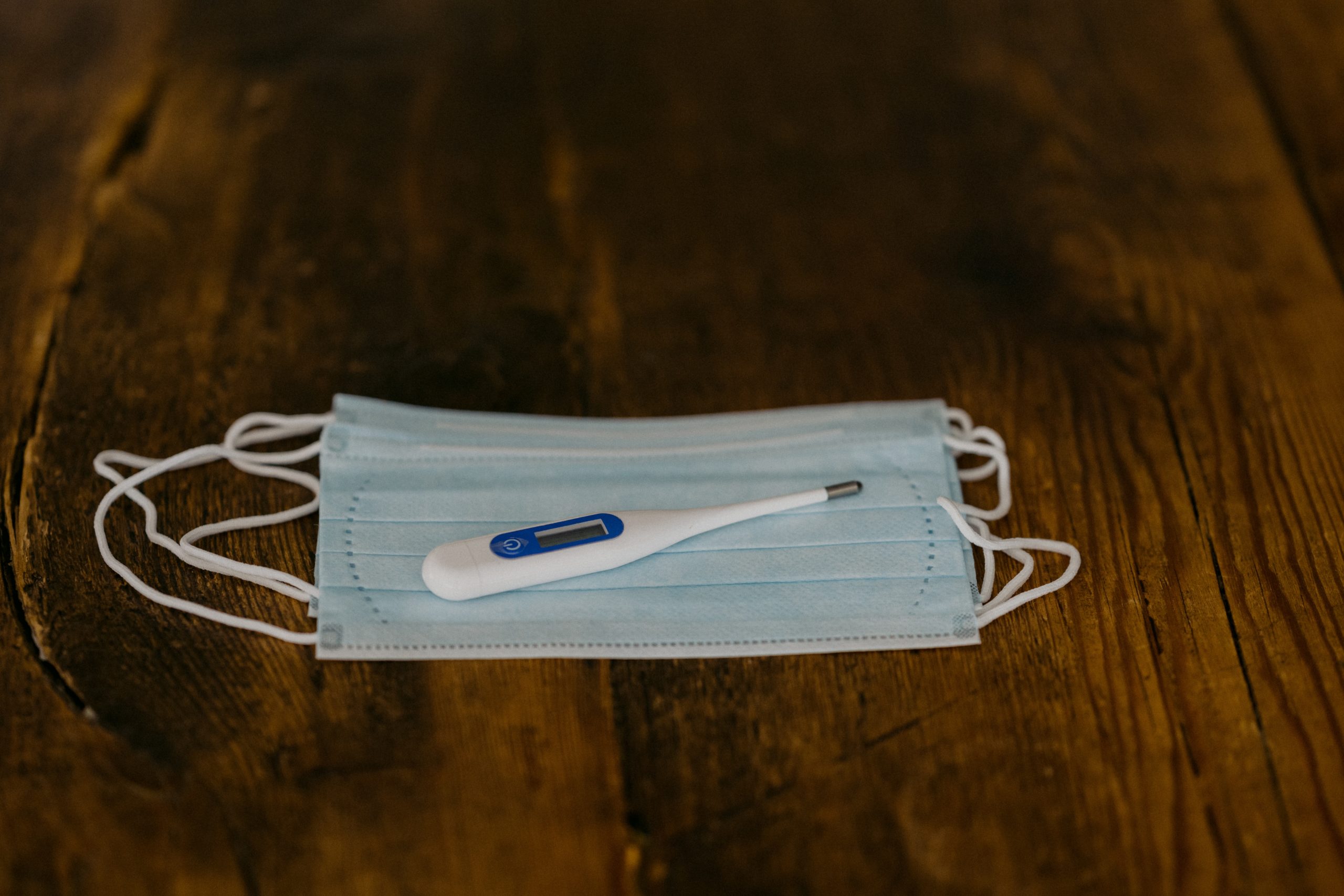 white and blue toothbrush on white textile