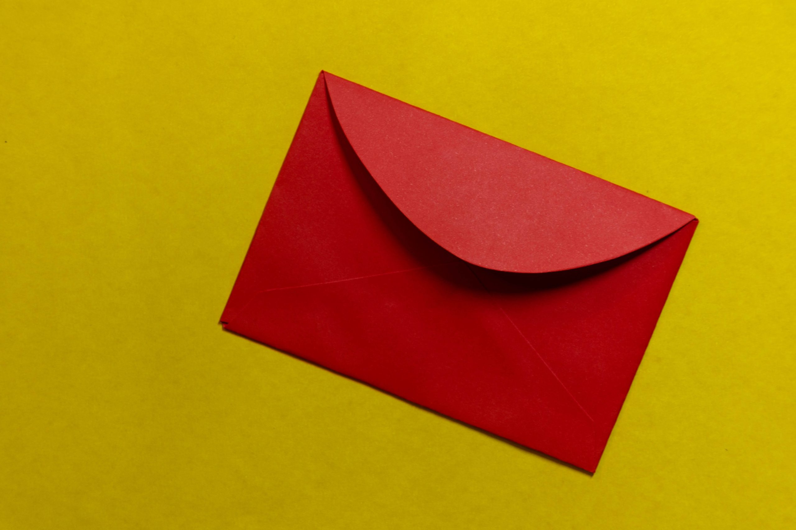 red paper on yellow surface
